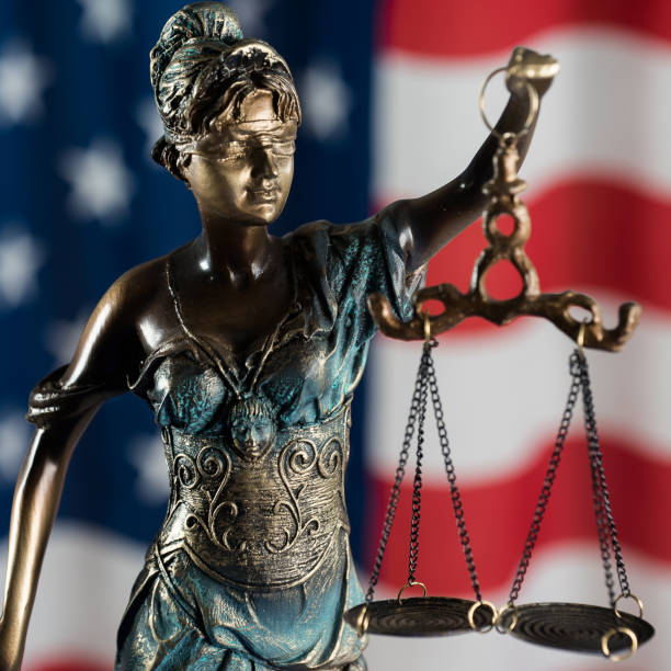 istock Law symbols on USA flag background. 842991052