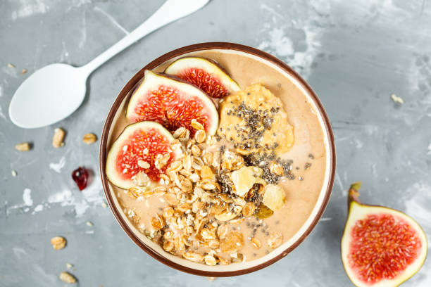 istock smoothie bowl with figs, peanut butter and muesli. 842991246