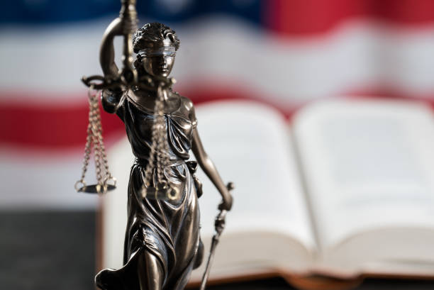 istock Law symbols on USA flag background. 842991496