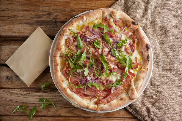 istock Italian pizza with bacon, broom, onion and cheese 842997400