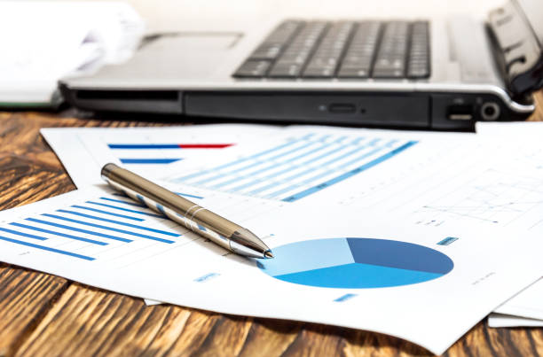 istock Pen on the business graphs at the workplace. 843000856