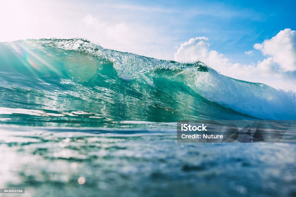 Blue wave in ocean and sky in tropics Wave - Water Stock Photo