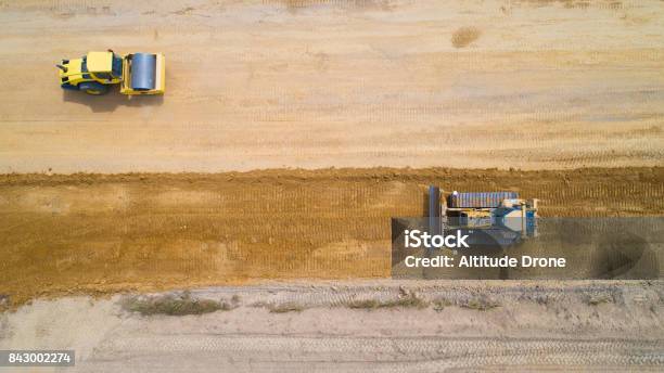 Aerial Photo Of A Steam Roller And A Backhoe On A Roadwork In Rouans France Stock Photo - Download Image Now