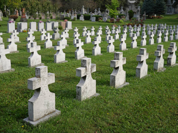 istock cemetery with cross shaped gravestones 843002380
