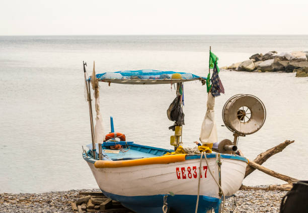 Fishing boat beached in Boccadasse (Genoa, Liguria, Italy) in April.