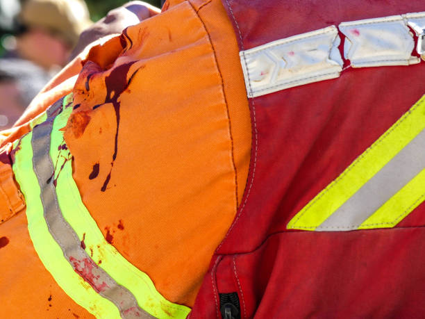 istock Injured fireman bloodstaines sleeve uniform 843005334