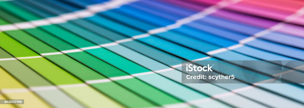 Open Pantone sample colors catalogue. Colour swatches book. Rainbow sample colors catalogue. Color Swatch Stock Photo