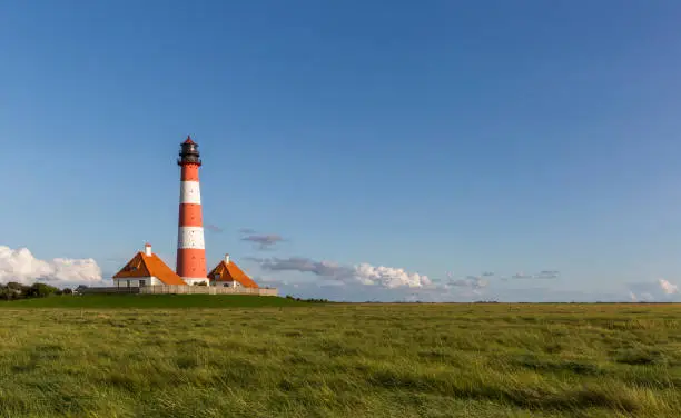 Colorful lighthouse at Westerhever, Schleswig-Holstein, nothern Germany