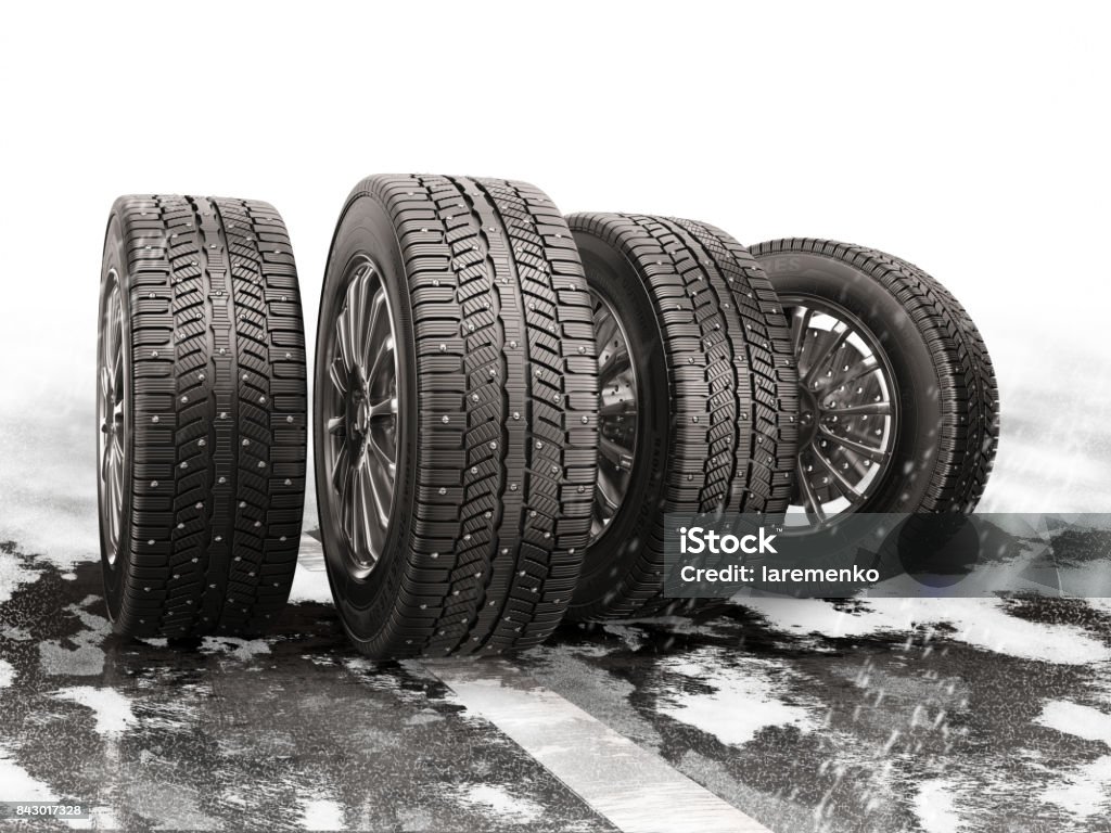 Four car tires rolling on a snow-covered road. Four car tires rolling on a snow-covered road. 3d illustration. Tire - Vehicle Part Stock Photo