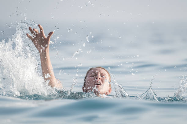 person drowns in the water - save oceans imagens e fotografias de stock