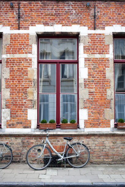 istock Vintage bicycle in front of old brick wall 843026578