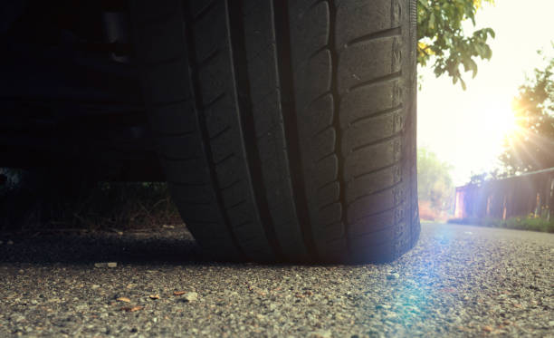 istock Tire on car close up on the sunset 843028934