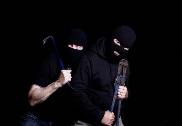 istock Two Burglars wearing balaclavas and carrying tools 843029328