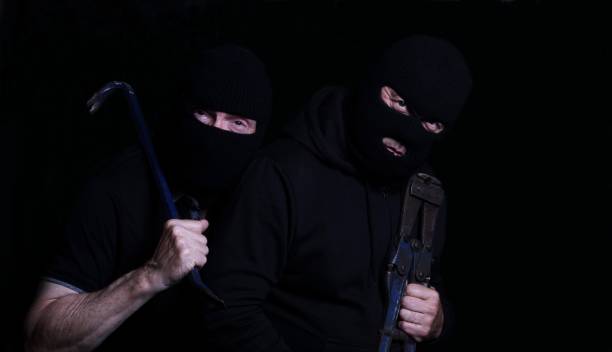 istock Two Burglars wearing balaclavas and carrying tools 843029330