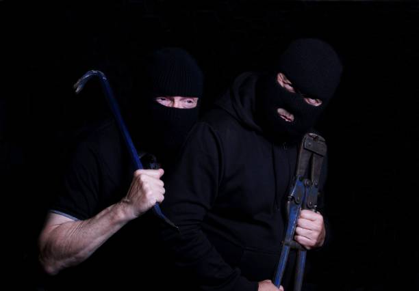 istock Two Burglars wearing balaclavas and carrying tools 843029352