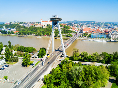 SNP New Bridge through Danude river aerial panoramic view in Bratislava. Bratislava is a capital of Slovakia.