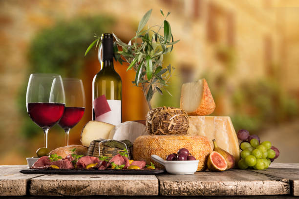 Various types of italian cheeses with red wine, still-life.