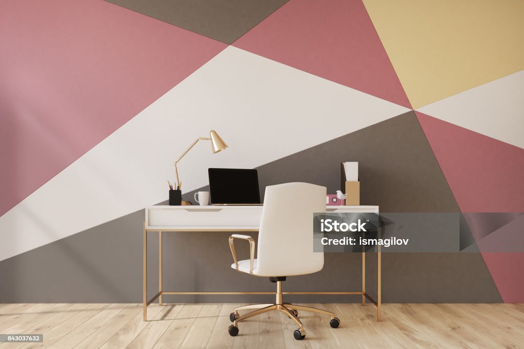 Black, red, yellow and white home office Black, red, yellow and white geometric wall pattern home office with a wooden floor, a square poster, a laptop and a white chair near a computer table. 3d rendering mock up Decoration Stock Photo