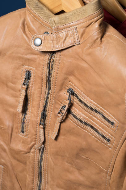 istock Light brown leather jacket. Beige color leather jacket on hanger 843041484
