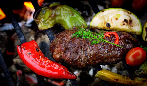 istock Grilled Beef steak with vegetables on the barbecue 843041898