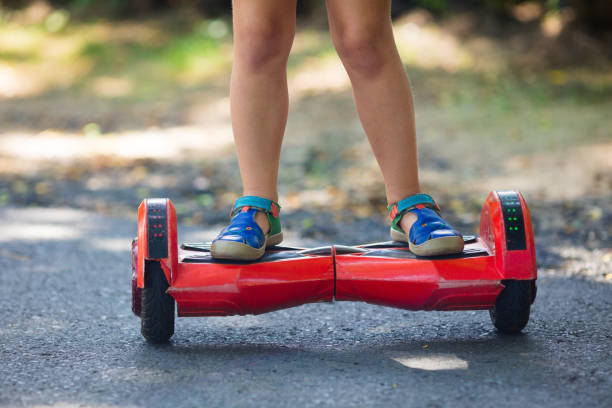istock Child on hover board. Kids ride scooter. 843045198