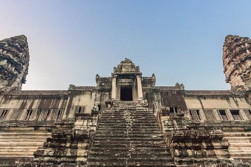 Stairs leading to upper galleries and towers of main Temple Mountain of ancient temple complex Angkor Wat in Siem Reap, Cambodia. Angkor Angkor Wat is the largest religious monument in the world.