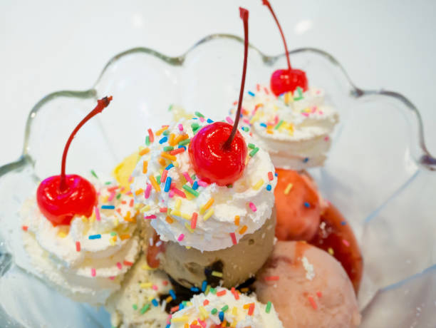 istock Ice cream scoops with whipped cream and cherry 843051894
