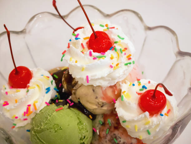 istock Ice cream scoops with cherry and whipped cream 843051898