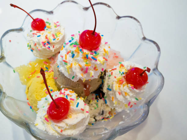 istock Ice cream scoops with whipped cream and cherry 843051902
