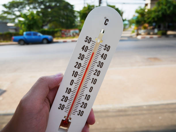 istock hand hold thermometer showing temperature in degrees Celsius 843052170