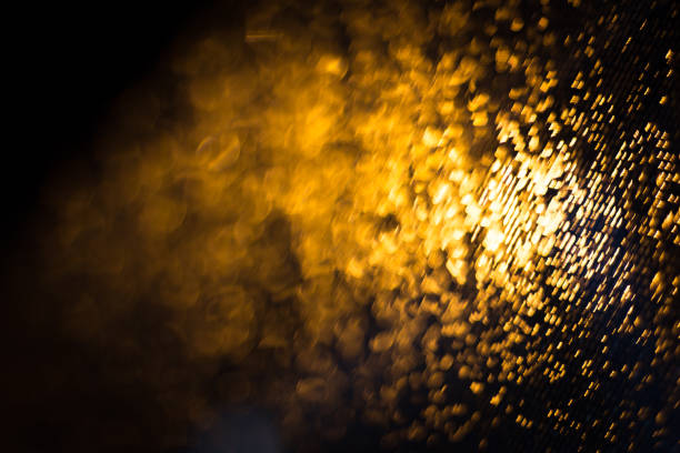 istock Abstract blur background of gold lighting during raining 843052558