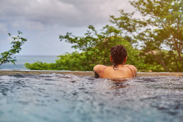istock Latina girl in pool 843061892