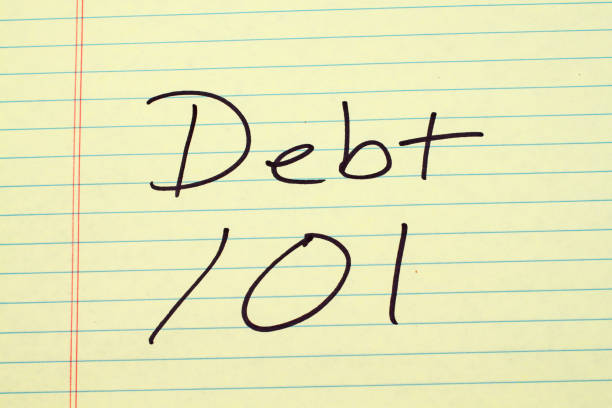 istock Debt 101 On A Yellow Legal Pad 843064874