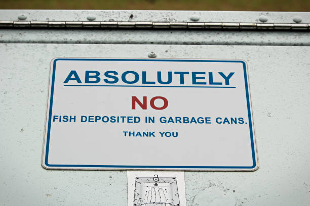 istock Absolutely no fish deposited in garbage can sign 843067760
