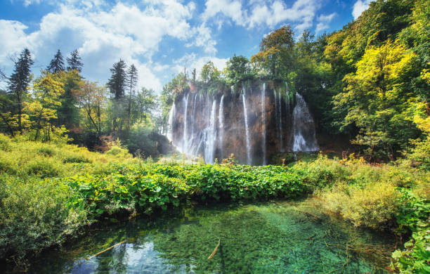 istock Waterfalls in national park falling into turquoise lake. Plitvice, Croatia 843068264
