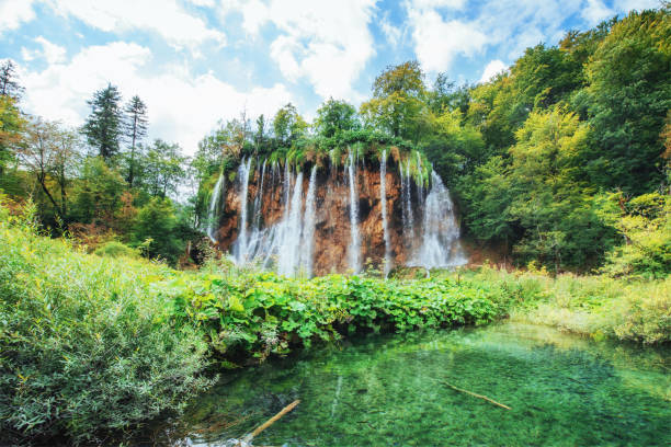 istock Waterfalls in national park falling into turquoise lake. Plitvice, Croatia 843068312
