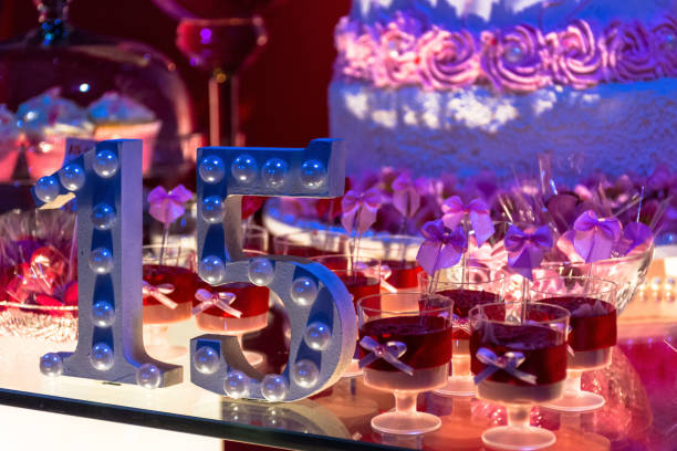 anniversary Party table with 15-year anniversary with Candy and cake with Blur 14 15 years photos stock pictures, royalty-free photos & images