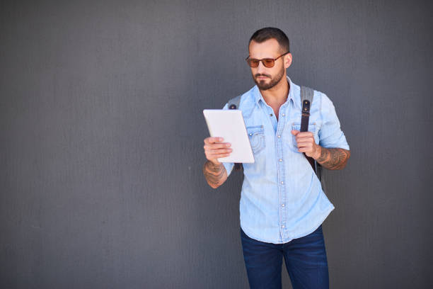 istock Young businessman in casual clothes over grey wall background 843075488
