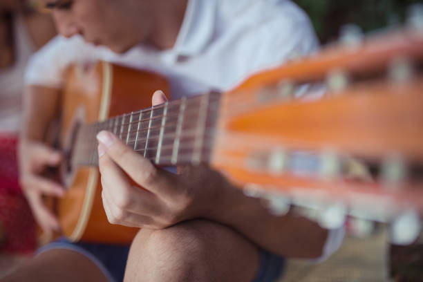 istock Couple singing and playing guitar on a picnic 843082580