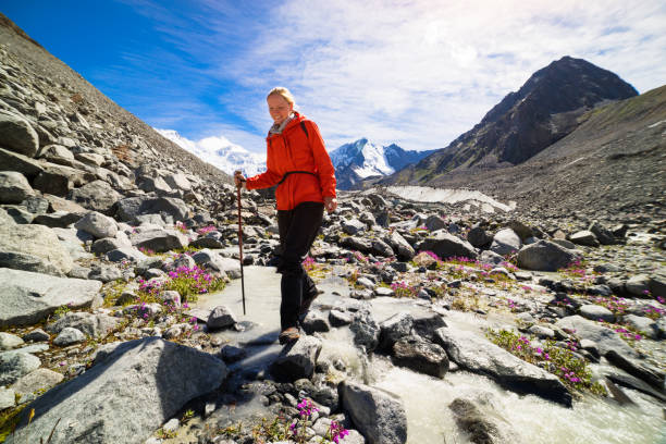 istock young woman hiking 843086648