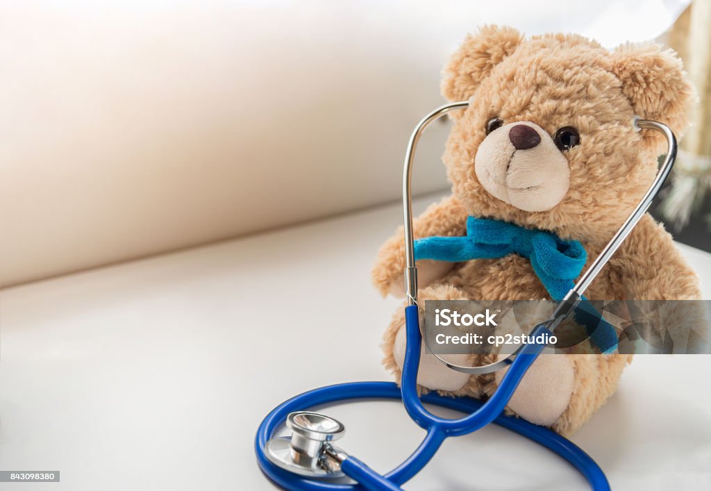 Children doctor concept - Teddy Bear with stethoscope. copy space Pediatrician Stock Photo
