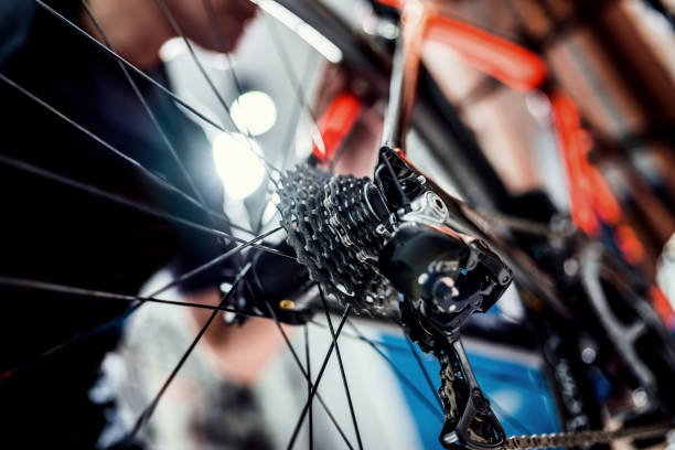 Technicians are repairing bicycles at shop sells stock photo
