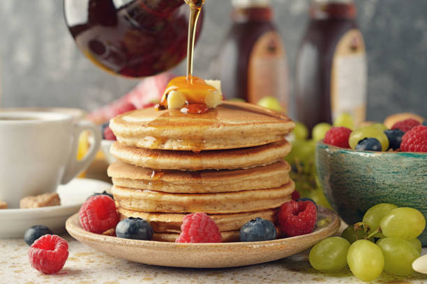 istock Pancakes with maple syrup and berries 843109658