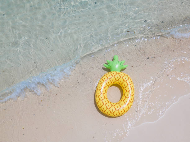 istock Aerial view of inflatable pineapple float on the sea 843110514