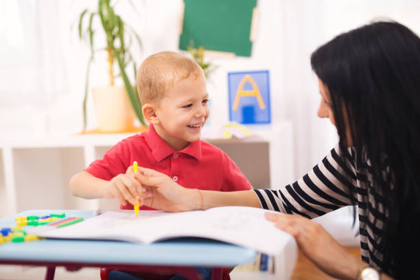 istock Child boy and mother playing with educational toy 843110640