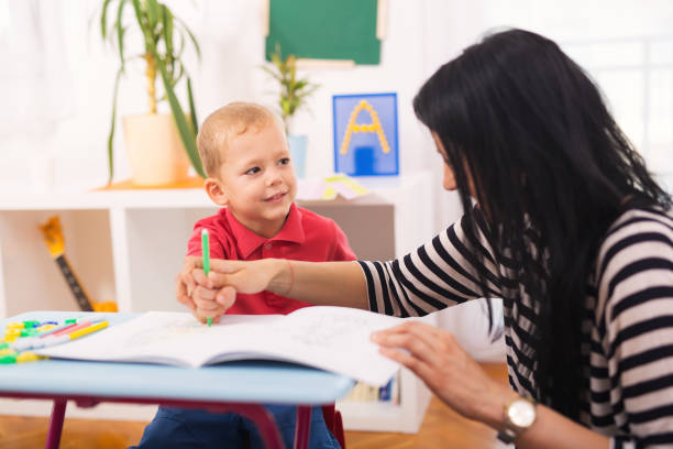 istock Child boy and mother playing with educational toy 843111048