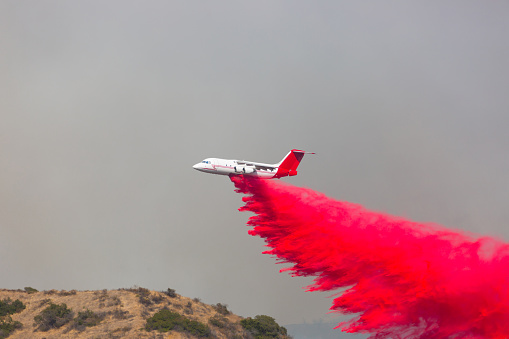 DC-10 flying around doing water and fire retardant drops on the moutains of Los Angeles. 

