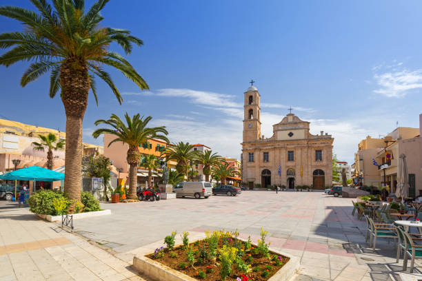 square at orthodox cathedral in the old town of chania - greece blue house wall imagens e fotografias de stock