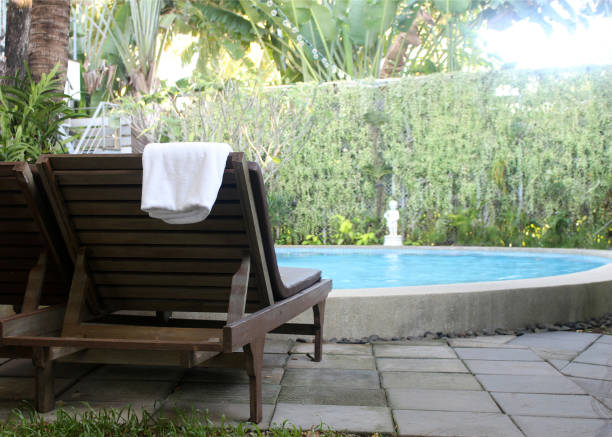 istock Beach chairs with towel near swimming pool 843122828