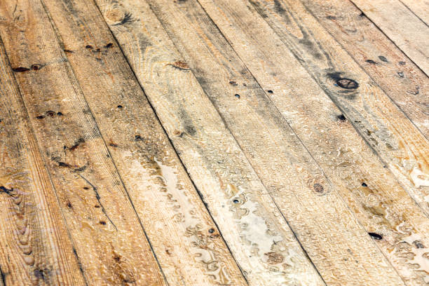 istock brown wooden floor with water drops after rain 843123222